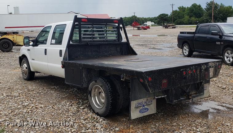 image for item DF2408 2006 Ford F350 Super Duty Crew Cab flatbed pickup truck