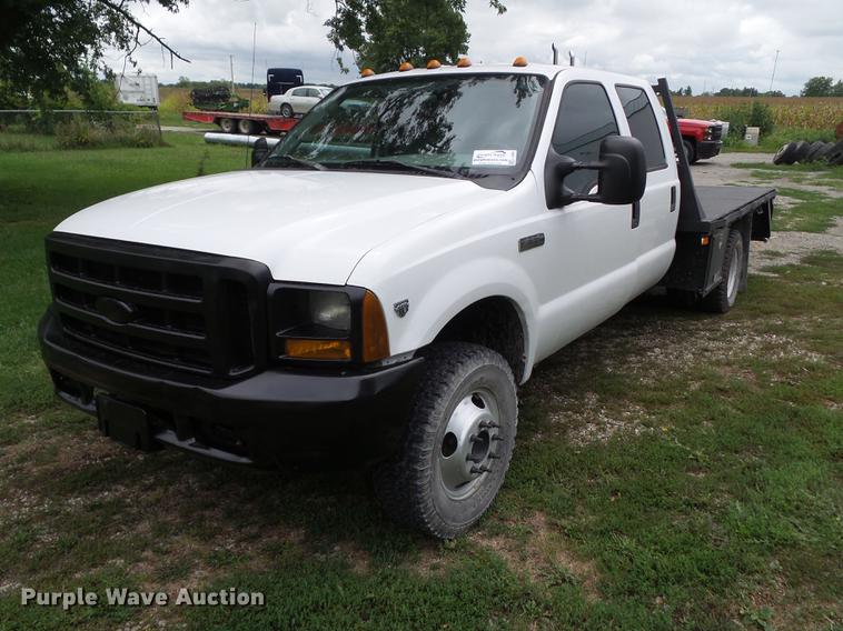 image for item L5695 2005 Ford F350 Super Duty Crew Cab flatbed pickup truck