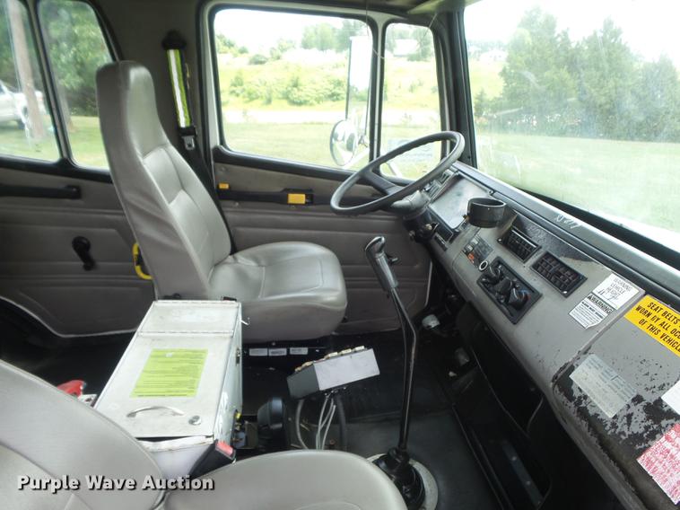 image for item DD7232 2005 Freightliner FL80 Crew Cab flatbed truck