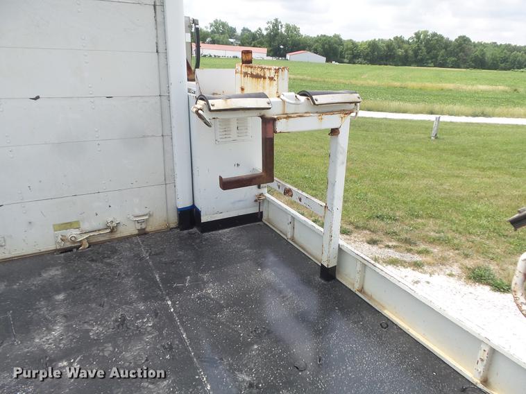 image for item DD7232 2005 Freightliner FL80 Crew Cab flatbed truck