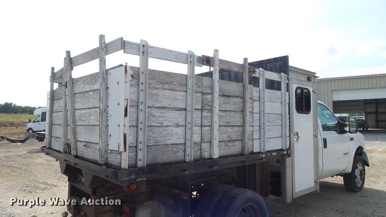 image for item DD7285 2003 Ford F450 Super Duty XL Crew Cab dump flatbed pickup truck