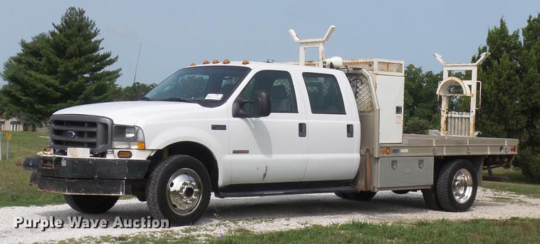 image for item DD7353 2003 Ford F550 Super Duty XL Crew Cab flatbed truck