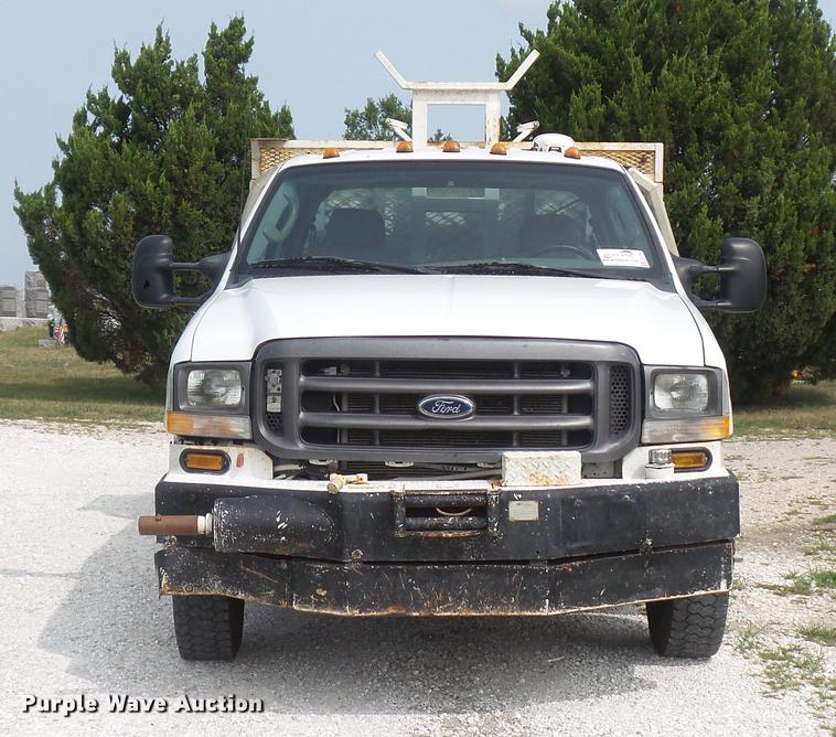 image for item DD7353 2003 Ford F550 Super Duty XL Crew Cab flatbed truck