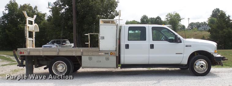 image for item DD7353 2003 Ford F550 Super Duty XL Crew Cab flatbed truck