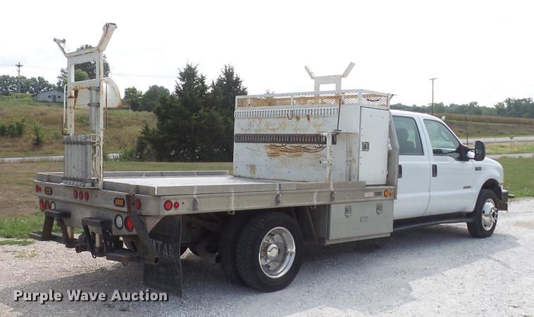 image for item DD7353 2003 Ford F550 Super Duty XL Crew Cab flatbed truck