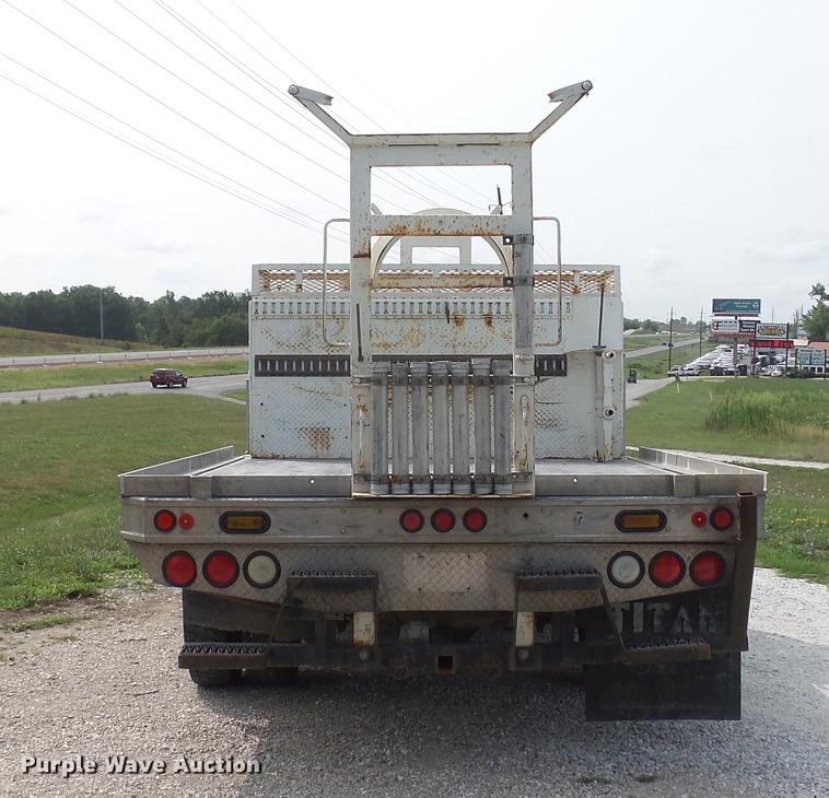 image for item DD7353 2003 Ford F550 Super Duty XL Crew Cab flatbed truck