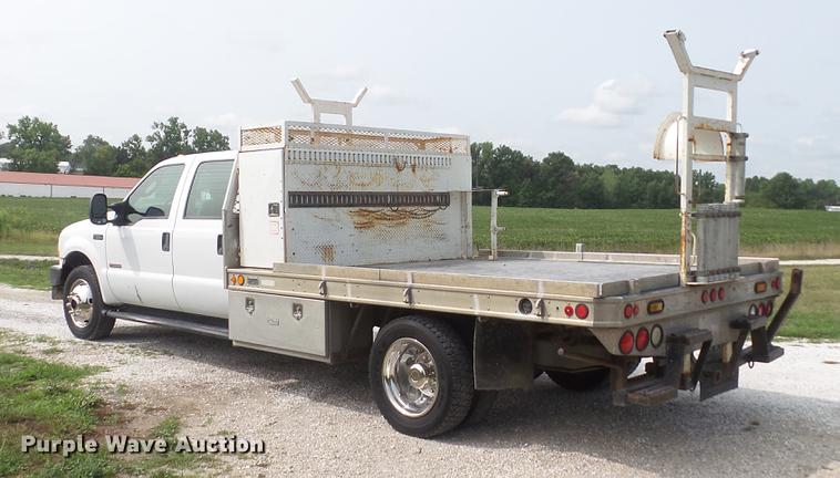 image for item DD7353 2003 Ford F550 Super Duty XL Crew Cab flatbed truck