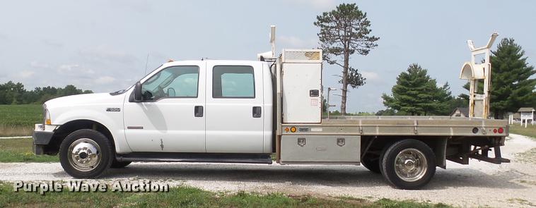 image for item DD7353 2003 Ford F550 Super Duty XL Crew Cab flatbed truck