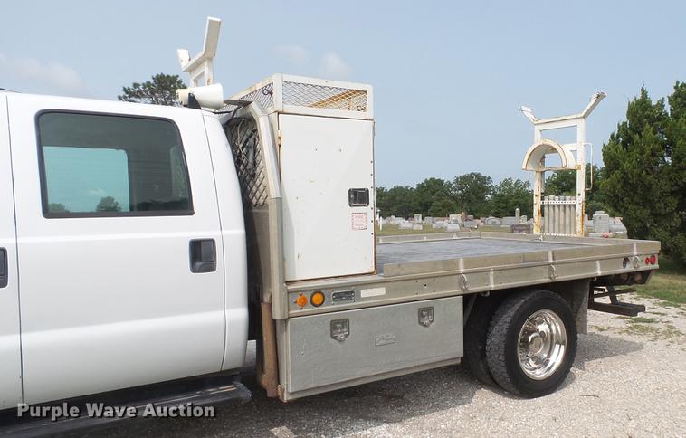 image for item DD7353 2003 Ford F550 Super Duty XL Crew Cab flatbed truck