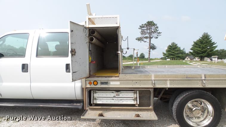image for item DD7353 2003 Ford F550 Super Duty XL Crew Cab flatbed truck