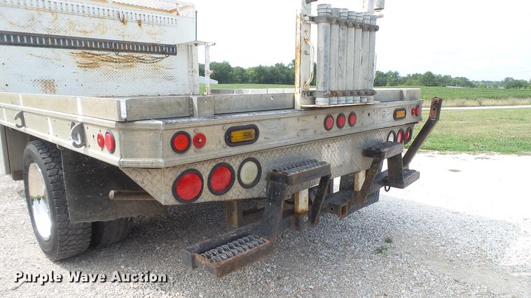 image for item DD7353 2003 Ford F550 Super Duty XL Crew Cab flatbed truck