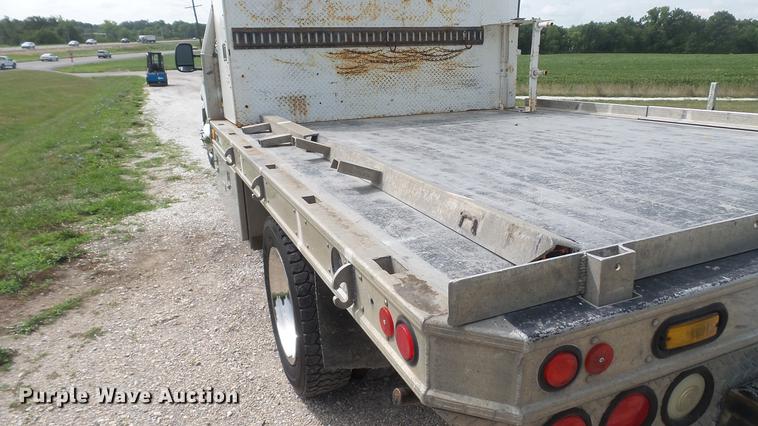 image for item DD7353 2003 Ford F550 Super Duty XL Crew Cab flatbed truck