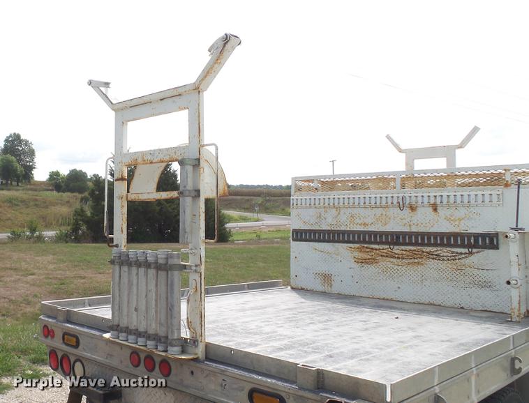 image for item DD7353 2003 Ford F550 Super Duty XL Crew Cab flatbed truck