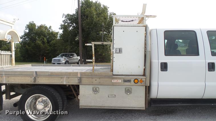 image for item DD7353 2003 Ford F550 Super Duty XL Crew Cab flatbed truck