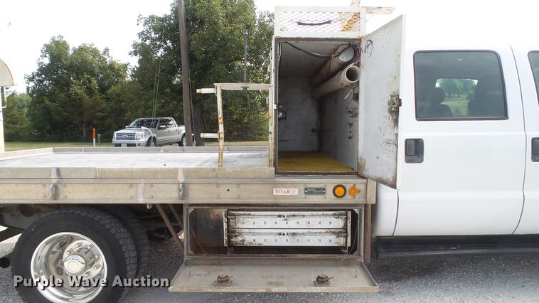 image for item DD7353 2003 Ford F550 Super Duty XL Crew Cab flatbed truck