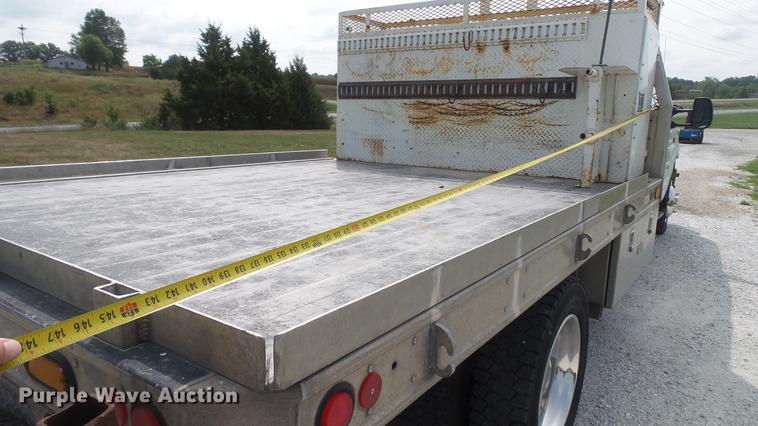 image for item DD7353 2003 Ford F550 Super Duty XL Crew Cab flatbed truck