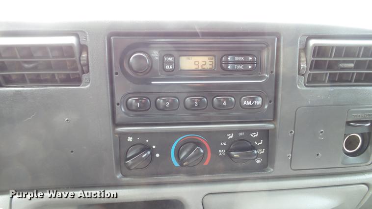 image for item DD7353 2003 Ford F550 Super Duty XL Crew Cab flatbed truck