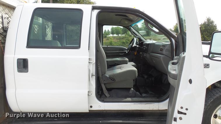 image for item DD7353 2003 Ford F550 Super Duty XL Crew Cab flatbed truck