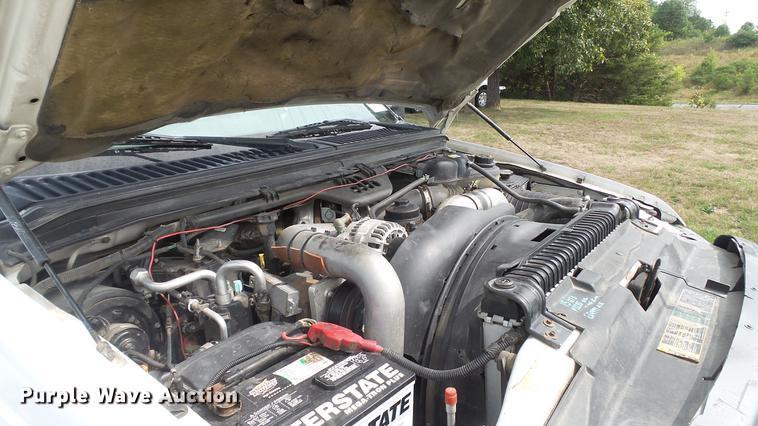 image for item DD7353 2003 Ford F550 Super Duty XL Crew Cab flatbed truck