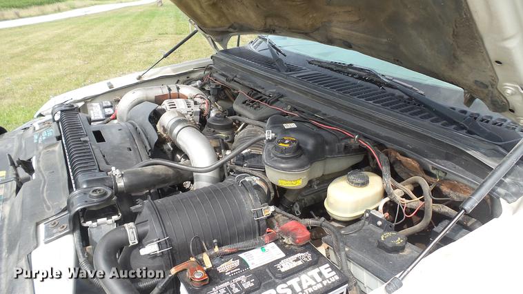 image for item DD7353 2003 Ford F550 Super Duty XL Crew Cab flatbed truck