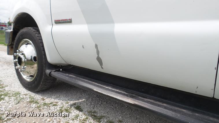 image for item DD7353 2003 Ford F550 Super Duty XL Crew Cab flatbed truck