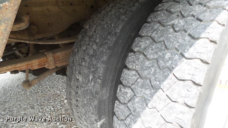 image for item DD7353 2003 Ford F550 Super Duty XL Crew Cab flatbed truck