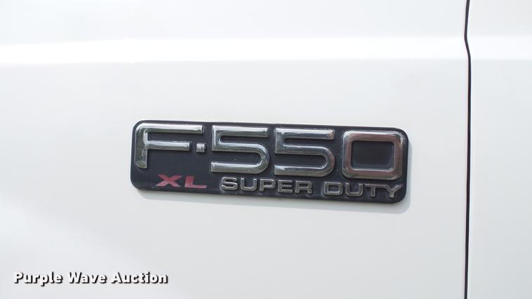 image for item DD7353 2003 Ford F550 Super Duty XL Crew Cab flatbed truck