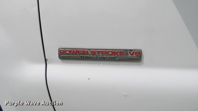 image for item DD7353 2003 Ford F550 Super Duty XL Crew Cab flatbed truck