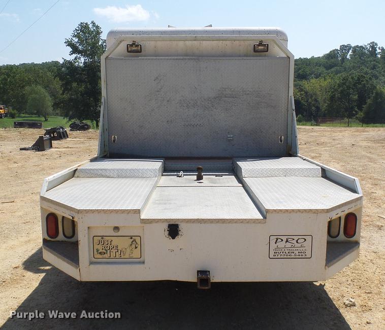 image for item DE5185 2000 Freightliner FL60 Crew Cab flatbed truck