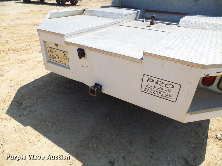 image for item DE5185 2000 Freightliner FL60 Crew Cab flatbed truck