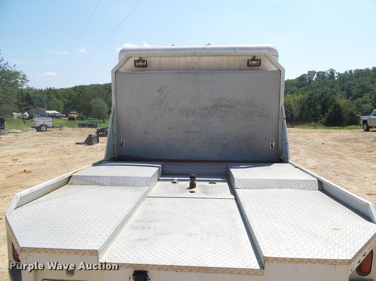 image for item DE5185 2000 Freightliner FL60 Crew Cab flatbed truck