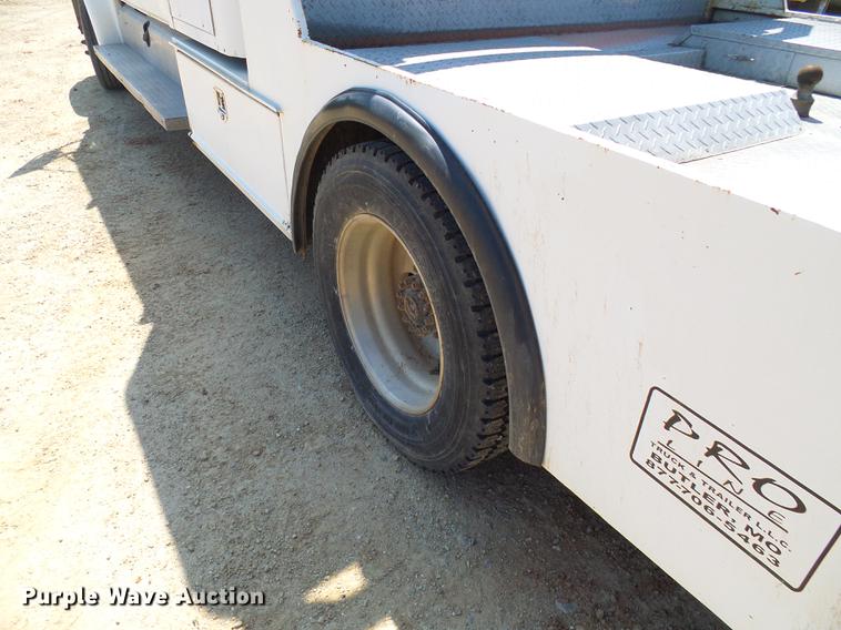 image for item DE5185 2000 Freightliner FL60 Crew Cab flatbed truck