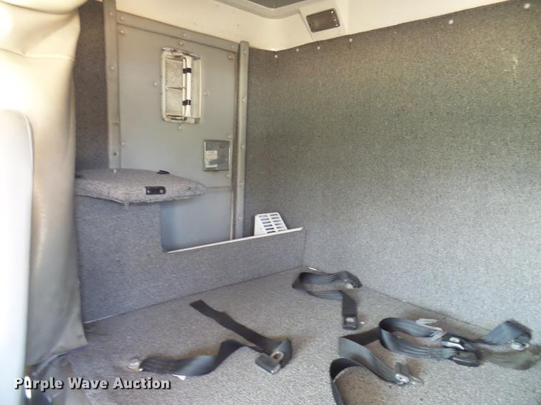 image for item DE5185 2000 Freightliner FL60 Crew Cab flatbed truck