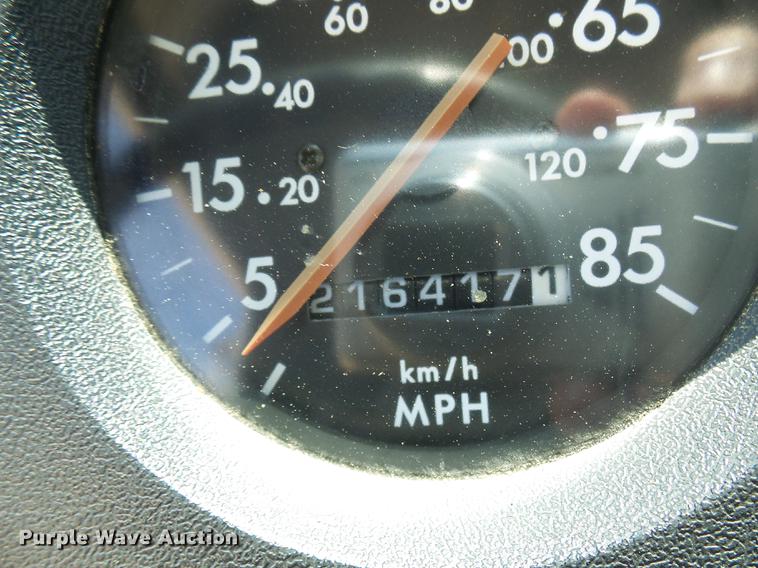 image for item DE5185 2000 Freightliner FL60 Crew Cab flatbed truck