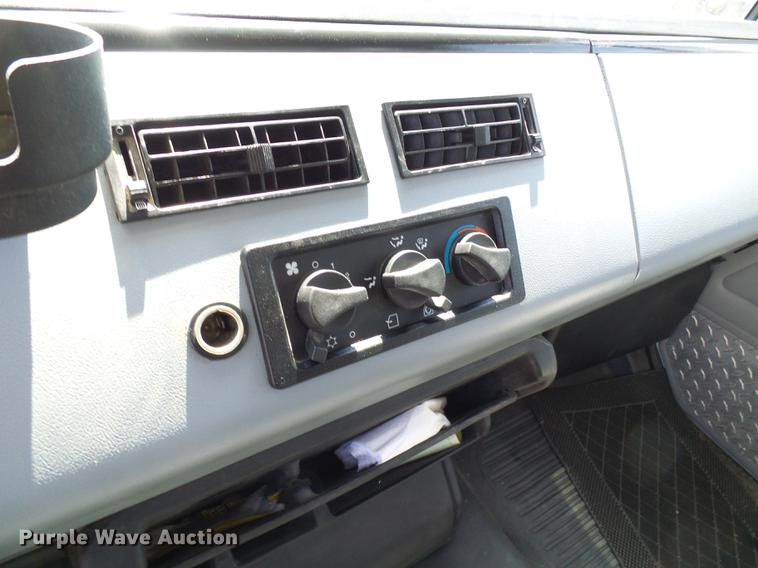 image for item DE5185 2000 Freightliner FL60 Crew Cab flatbed truck