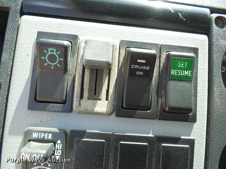 image for item DE5185 2000 Freightliner FL60 Crew Cab flatbed truck