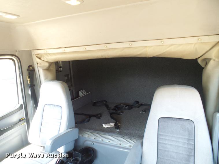 image for item DE5185 2000 Freightliner FL60 Crew Cab flatbed truck