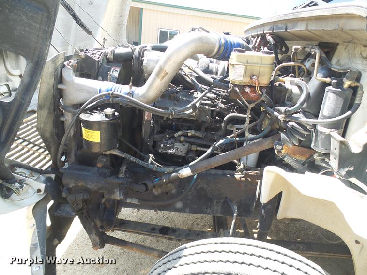 image for item DE5185 2000 Freightliner FL60 Crew Cab flatbed truck