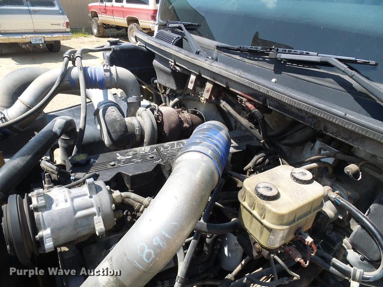 image for item DE5185 2000 Freightliner FL60 Crew Cab flatbed truck