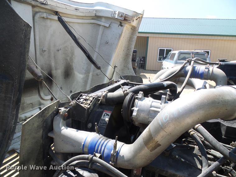 image for item DE5185 2000 Freightliner FL60 Crew Cab flatbed truck