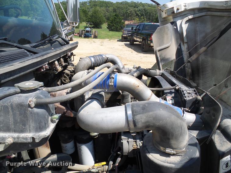 image for item DE5185 2000 Freightliner FL60 Crew Cab flatbed truck