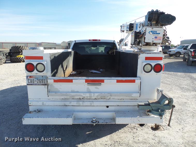 image for item EI9646 2009 GMC Sierra 3500 utility bed pickup truck with crane