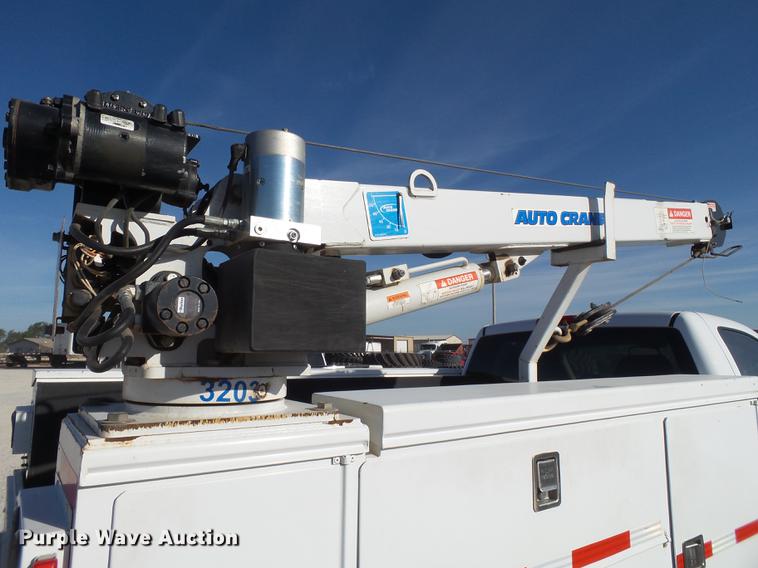 image for item EI9646 2009 GMC Sierra 3500 utility bed pickup truck with crane