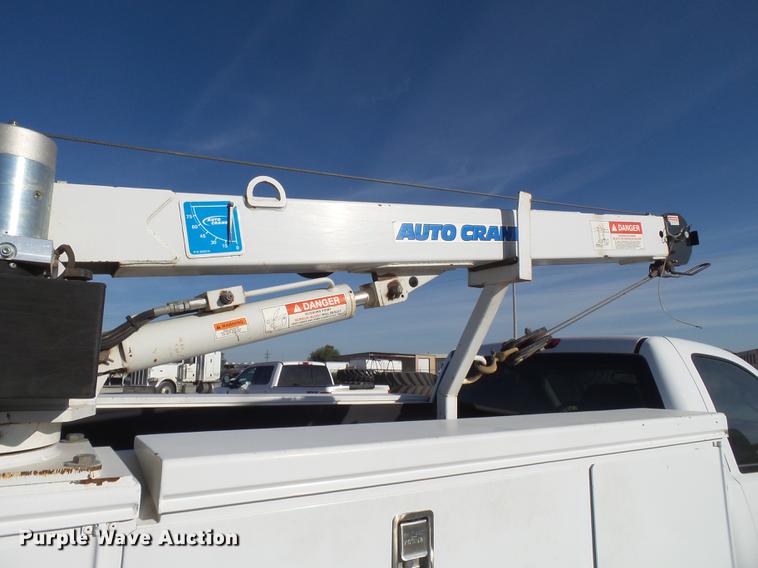 image for item EI9646 2009 GMC Sierra 3500 utility bed pickup truck with crane