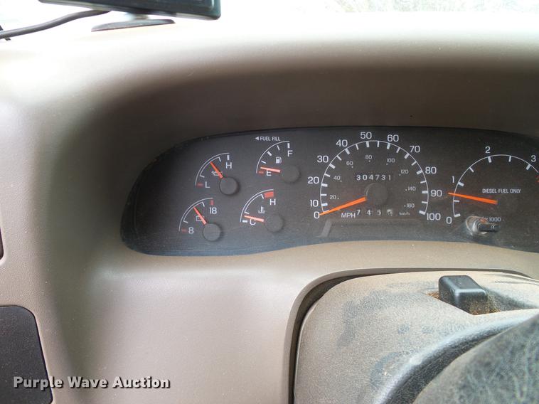 image for item FE9502 1999 Ford F350 Super Duty SuperCab flatbed pickup truck