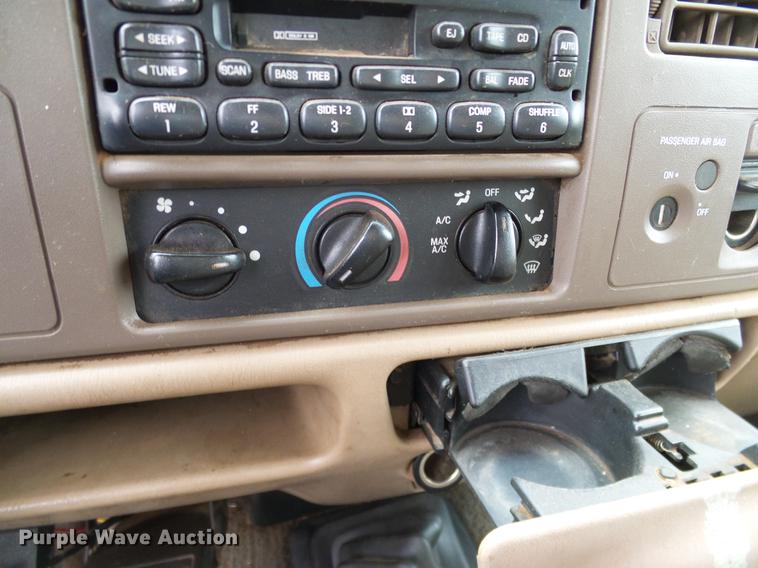 image for item FE9502 1999 Ford F350 Super Duty SuperCab flatbed pickup truck