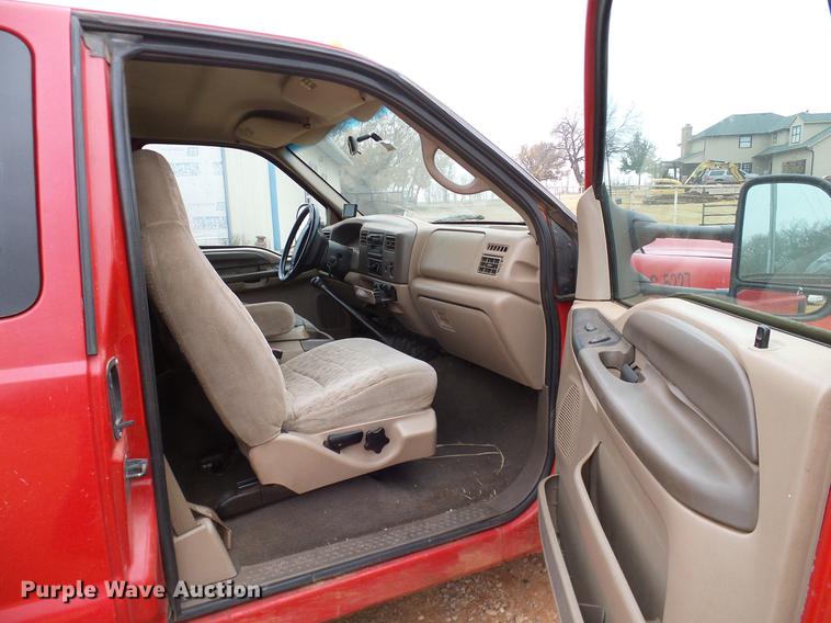 image for item FE9502 1999 Ford F350 Super Duty SuperCab flatbed pickup truck