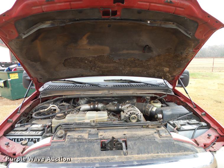 image for item FE9502 1999 Ford F350 Super Duty SuperCab flatbed pickup truck