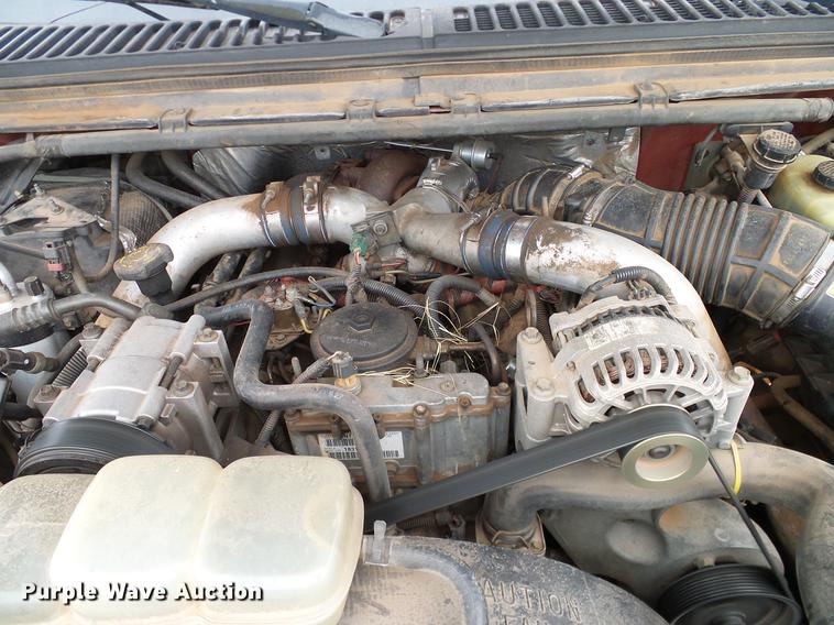 image for item FE9502 1999 Ford F350 Super Duty SuperCab flatbed pickup truck