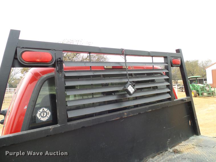 image for item FE9502 1999 Ford F350 Super Duty SuperCab flatbed pickup truck